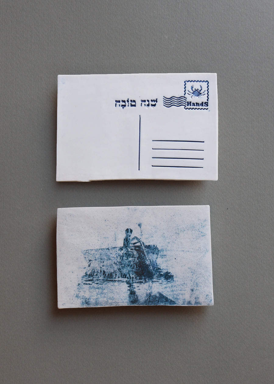 ילד חותר על סירה קטנה, בול מזל סרטן