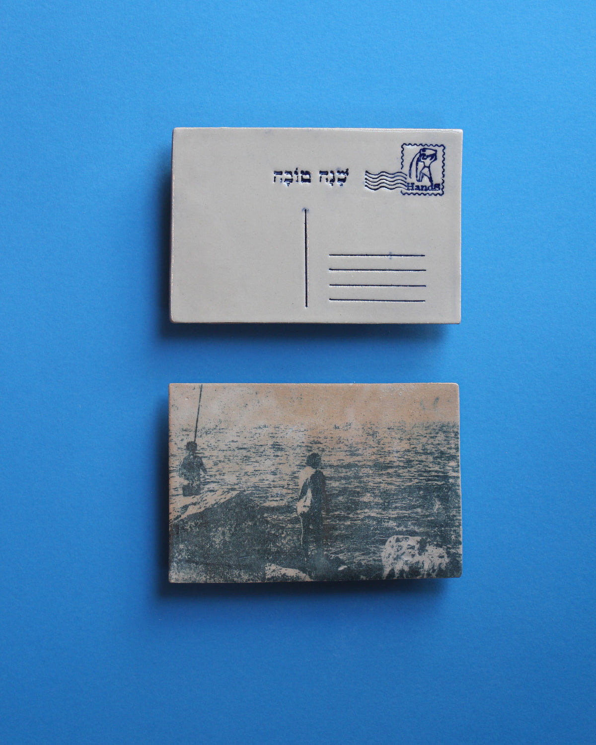 נערים דגים על המזח, בול מזל דלי